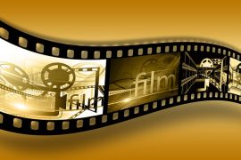 Imagem de um rolo de fita de cinema.