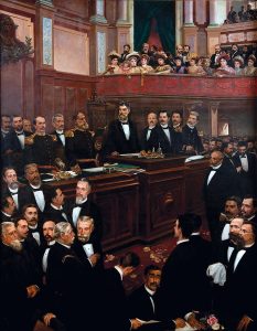 Quadro representa os legisladores em primeiro plano e ao fundo - plateia - mulheres que desejavam o direito ao voto.